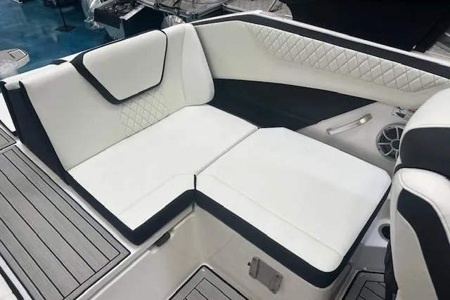 Slide: The Image of 2025 Yamaha Boats 222SE interior with white cushioned seating and modern design. - 13
