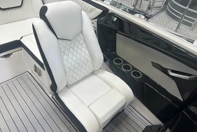 Slide: The Image of 2025 Yamaha Boats 222SE interior with luxurious white seating and sleek design. - 14