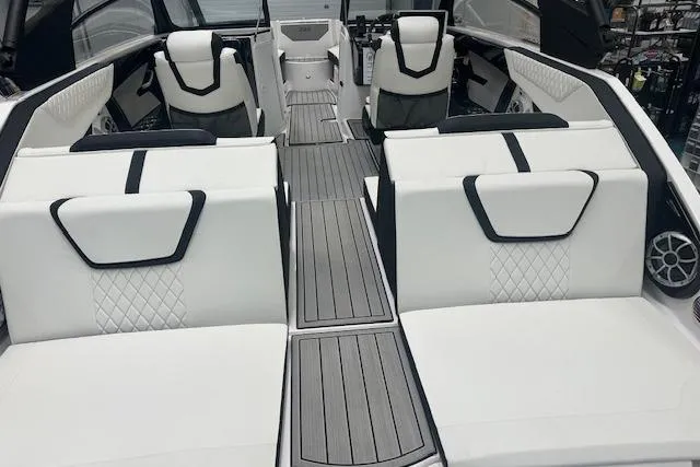 Slide: The Image of 2025 Yamaha Boats 222SE interior with white seating and modern design. - 17