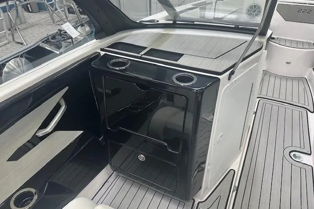 Slide: The Image of 2025 Yamaha Boats 222SE interior with sleek black cabinetry and modern design elements. - 4
