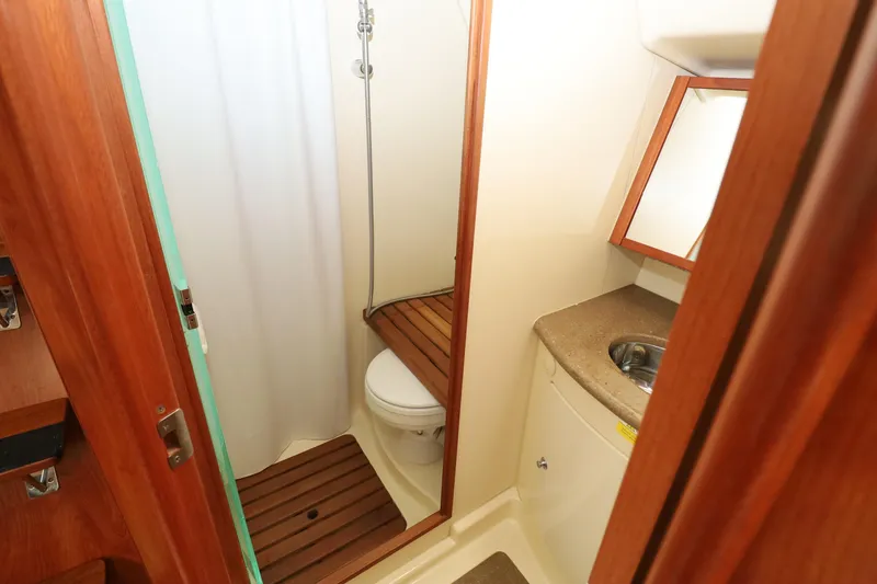 Slide: The Image of 2011 Hunter 39 yacht bathroom with shower, toilet, and sink. - 11