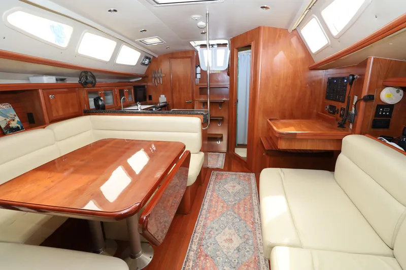 Slide: The Image of Luxurious interior of 2011 Hunter 39 yacht with wood finish and comfortable seating. - 20