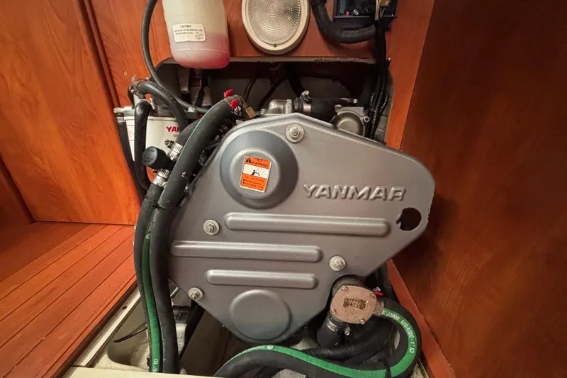 Slide: The Image of Yanmar engine inside a 2011 Hunter 39 sailboat, showcasing mechanical components. - 21