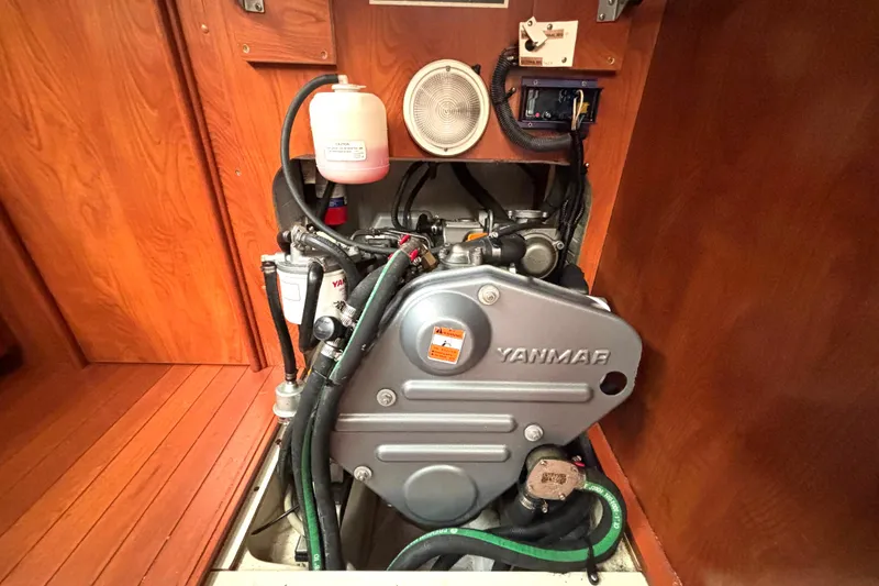 Slide: The Image of Engine compartment of a 2011 Hunter 39 sailboat featuring a Yanmar engine. - 22