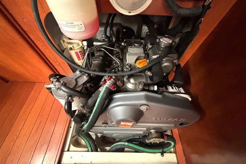 Slide: The Image of Engine compartment of a 2011 Hunter 39 sailboat, featuring a Yanmar engine. - 24