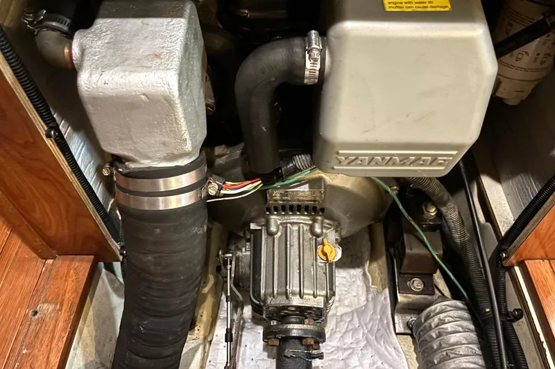 Slide: The Image of Engine compartment of a 2011 Hunter 39 sailboat featuring a Yanmar engine. - 26