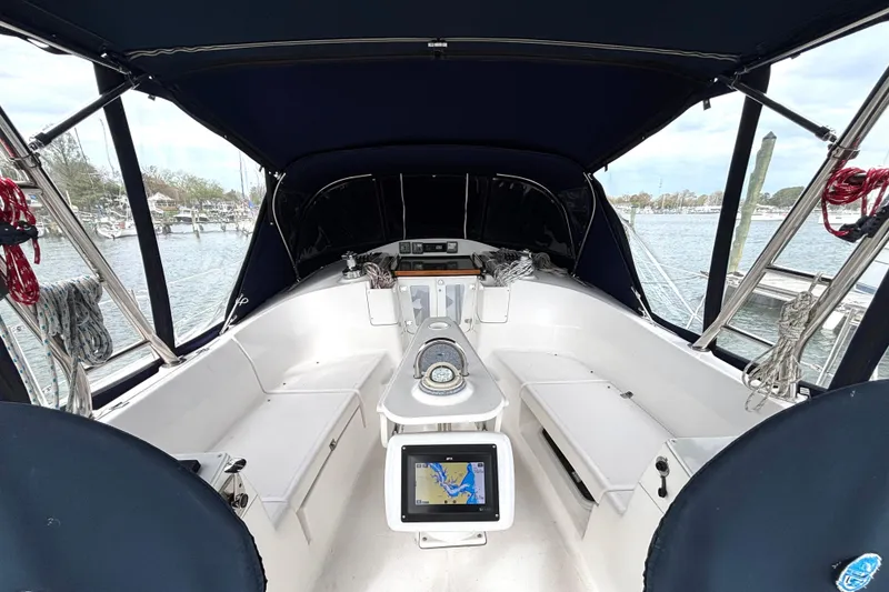Slide: The Image of Interior view of a 2011 Hunter 39 sailboat cockpit with navigation equipment. - 30