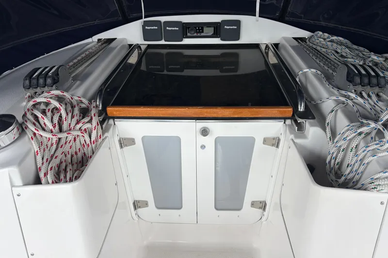 Slide: The Image of Cockpit of 2011 Hunter 39 sailboat with ropes and navigation equipment. - 31