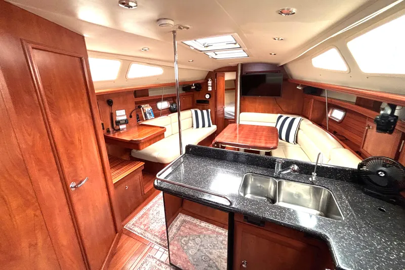 Slide: The Image of Luxurious interior of 2011 Hunter 39 yacht with modern kitchen and cozy seating area. - 4