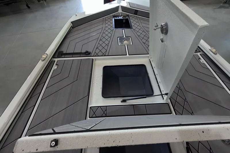 Slide: The Image of 2026 Avid 20 Vertex boat interior with open storage compartments and sleek design. - 17