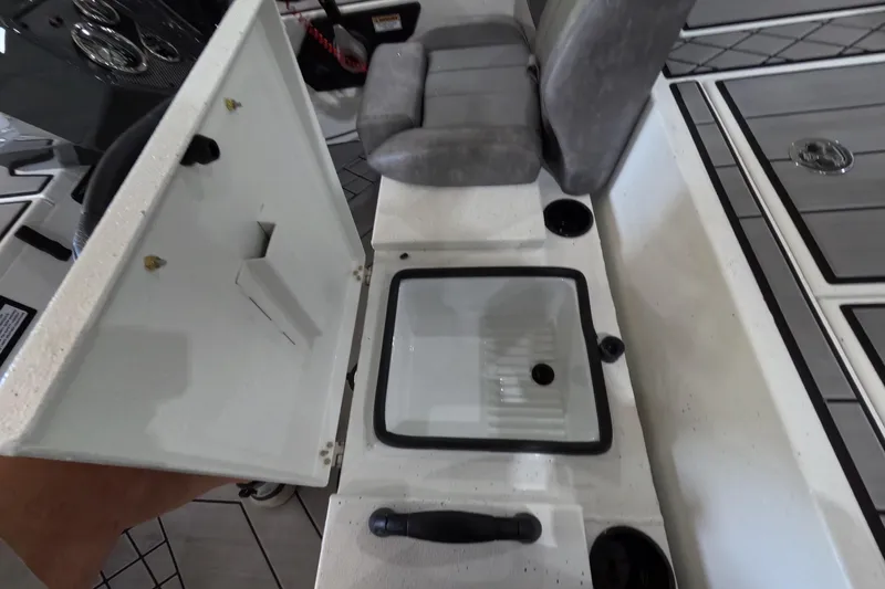 Slide: The Image of 2026 Avid 20 Vertex boat interior with open storage compartment and seating. - 18