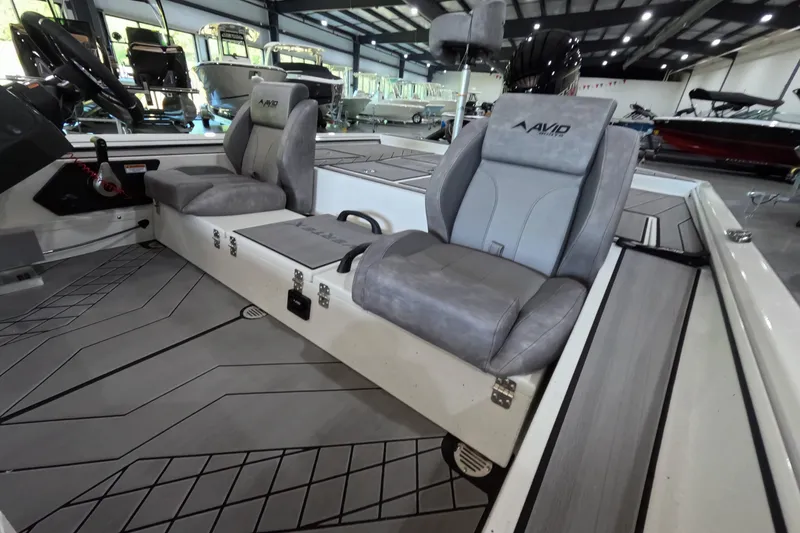 Slide: The Image of 2026 Avid 20 Vertex boat interior with gray seating and modern design. - 5