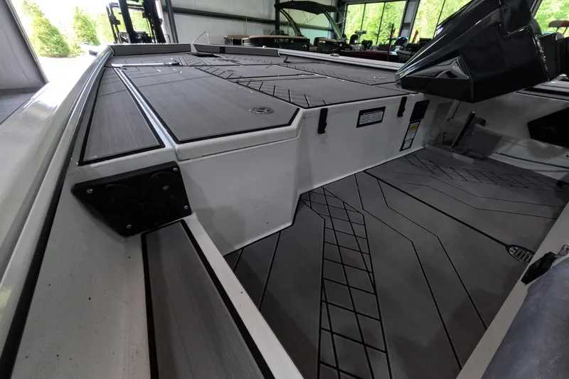 Slide: The Image of Interior view of 2026 Avid 20 Vertex boat, showcasing sleek deck design and storage compartments. - 6
