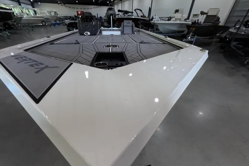 Slide: The Image of 2026 Avid 20 Vertex boat interior with sleek design in showroom setting. - 7