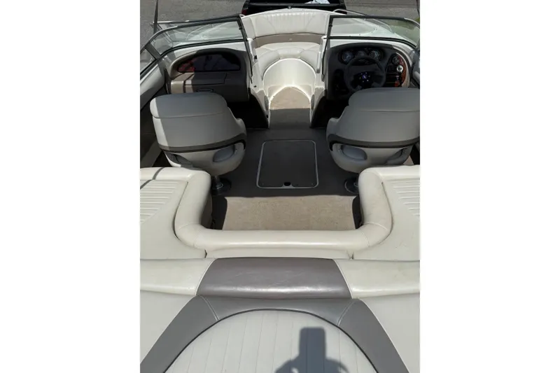 Slide: The Image of Interior view of a 2003 Four Winns 210 Horizon boat, featuring seating and dashboard. - 5