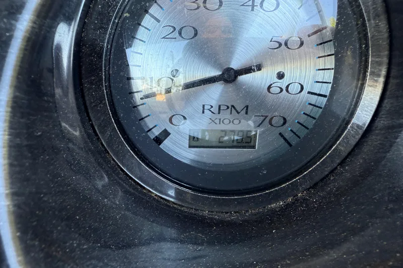 Slide: The Image of Close-up of a 2017 Bennington 21 SLX RPM gauge displaying 2705 RPM. - 18