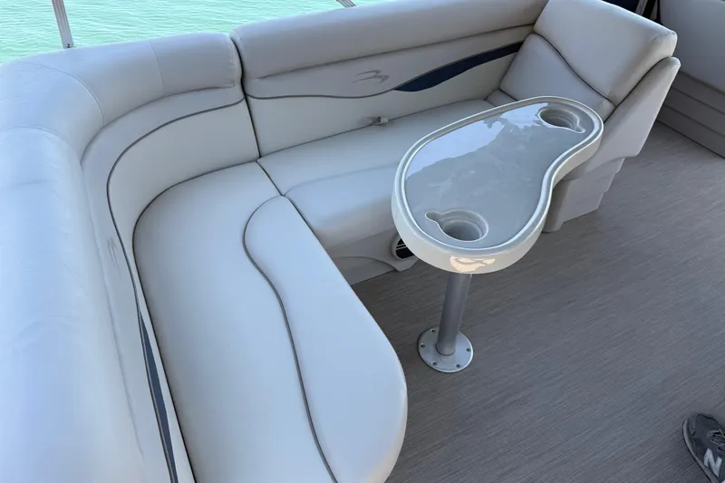 Slide: The Image of Luxurious seating area on a 2017 Bennington 21 SLX boat with a sleek table. - 27