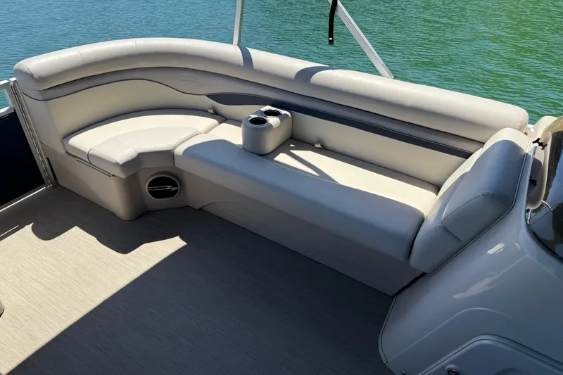 Slide: The Image of 2017 Bennington 21 SLX pontoon boat interior with cushioned seating and cup holders. - 29