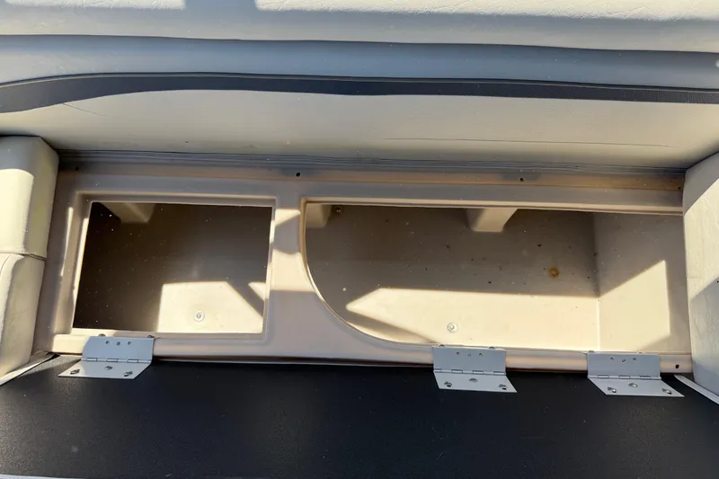 Slide: The Image of Open storage compartment in a 2017 Bennington 21 SLX boat, showcasing interior space. - 30