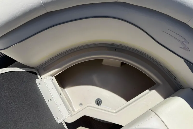 Slide: The Image of 2017 Bennington 21 SLX boat seat storage compartment, open and empty. - 31