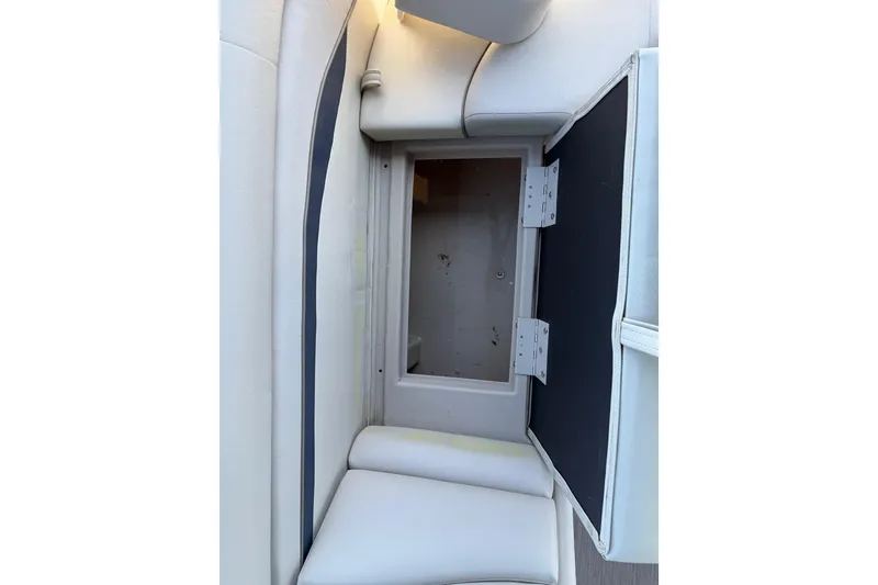 Slide: The Image of Open storage compartment in 2017 Bennington 21 SLX boat with white seating. - 34