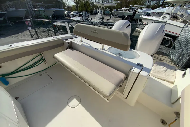 Slide: The Image of 2017 Cobia 277 Center Console boat interior with seating and storage. - 13