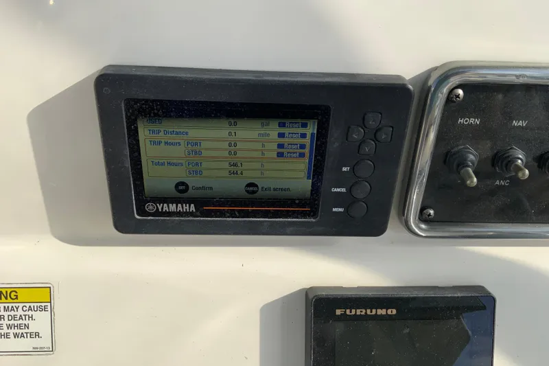 Slide: The Image of Yamaha display on 2017 Cobia 277 Center Console boat dashboard with trip data. - 17