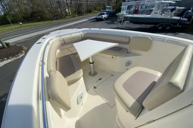 Slide: The Image of 2017 Cobia 277 Center Console boat with spacious seating and table in the bow area. - 20