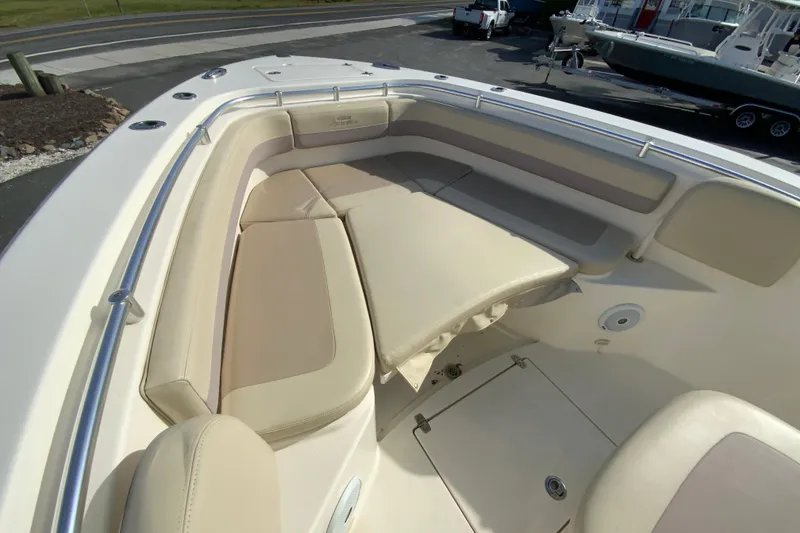 Slide: The Image of 2017 Cobia 277 Center Console boat with spacious seating and storage area. - 21