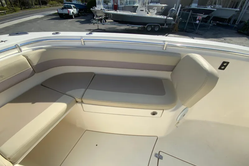 Slide: The Image of 2017 Cobia 277 Center Console boat interior with cushioned seating area. - 22