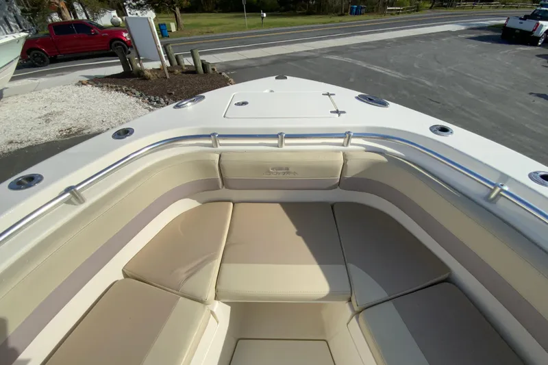 Slide: The Image of 2017 Cobia 277 Center Console boat with spacious bow seating and stainless steel railings. - 23