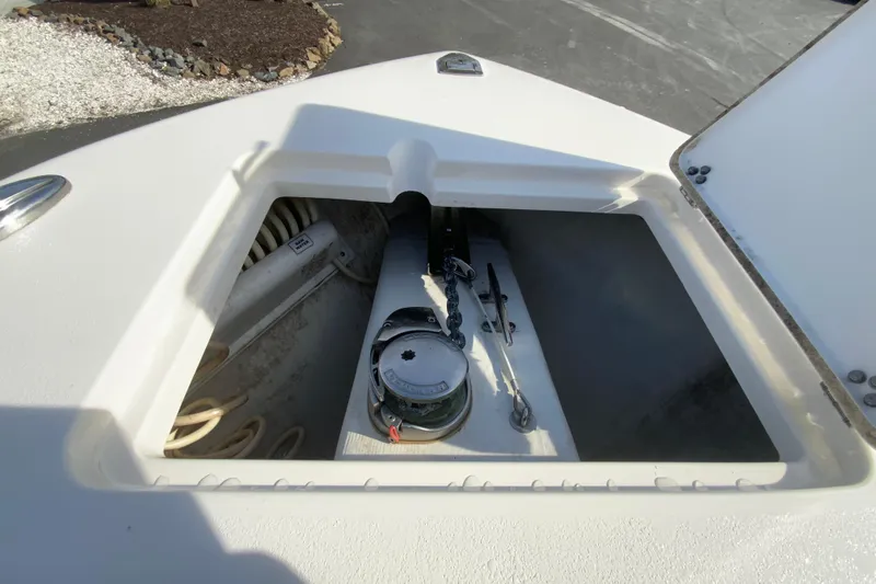Slide: The Image of Anchor storage compartment on a 2017 Cobia 277 Center Console boat. - 24