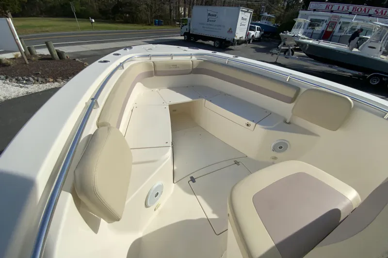 Slide: The Image of 2017 Cobia 277 Center Console boat interior with seating and storage compartments. - 28