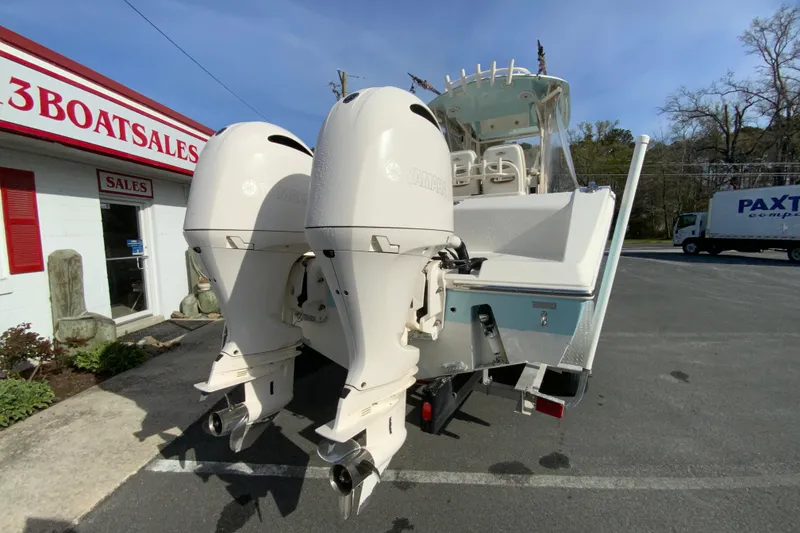 Slide: The Image of 2017 Cobia 277 Center Console boat with dual Yamaha outboard engines at a sales lot. - 9