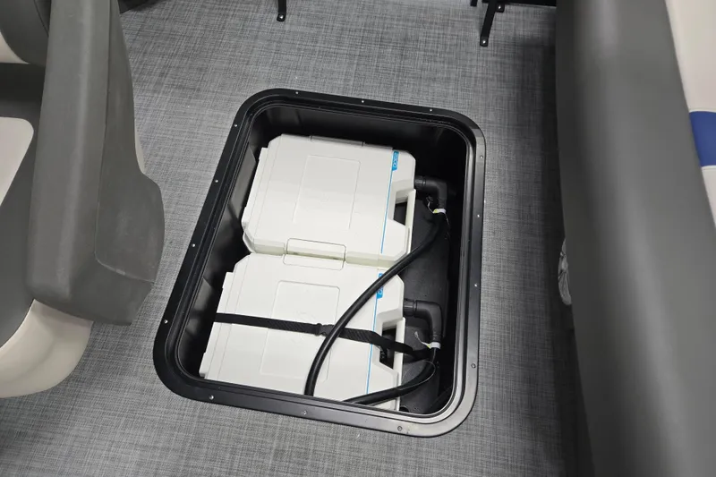 Slide: The Image of Battery compartment of 2026 Princecraft Brio 17 Electric boat, showcasing dual batteries. - 10