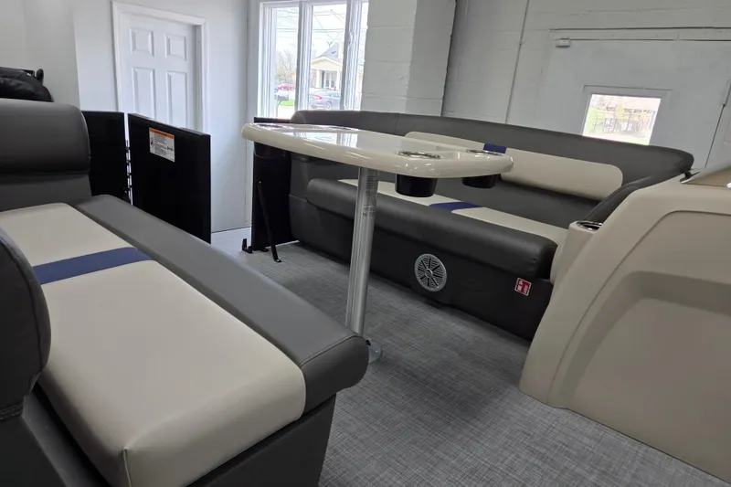 Slide: The Image of Interior of 2026 Princecraft Brio 17 Electric boat with modern seating and table. - 13