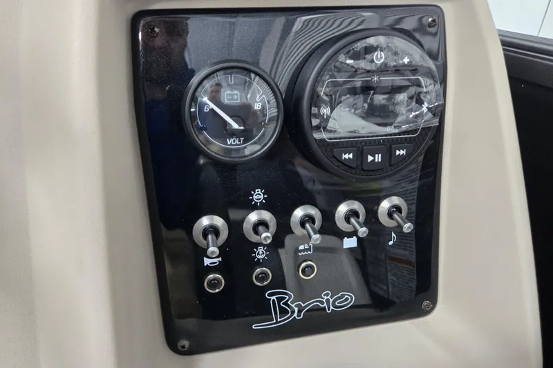 Slide: The Image of Control panel of 2026 Princecraft Brio 17 Electric boat with gauges and switches. - 15