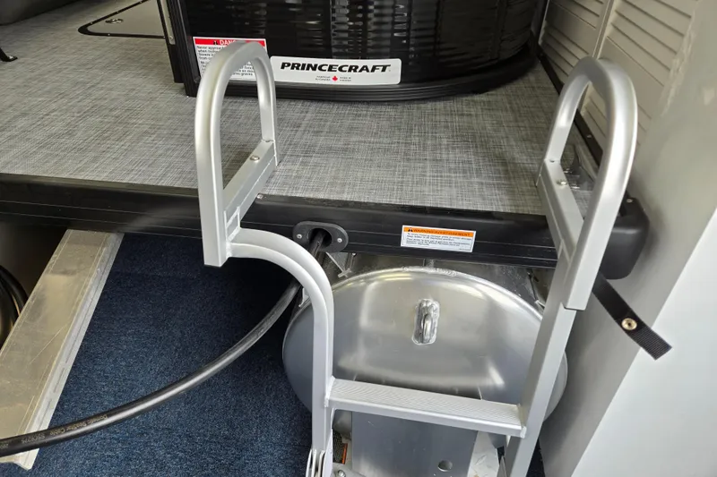 Slide: The Image of 2026 Princecraft Brio 17 Electric boat interior with ladder and storage compartment. - 17