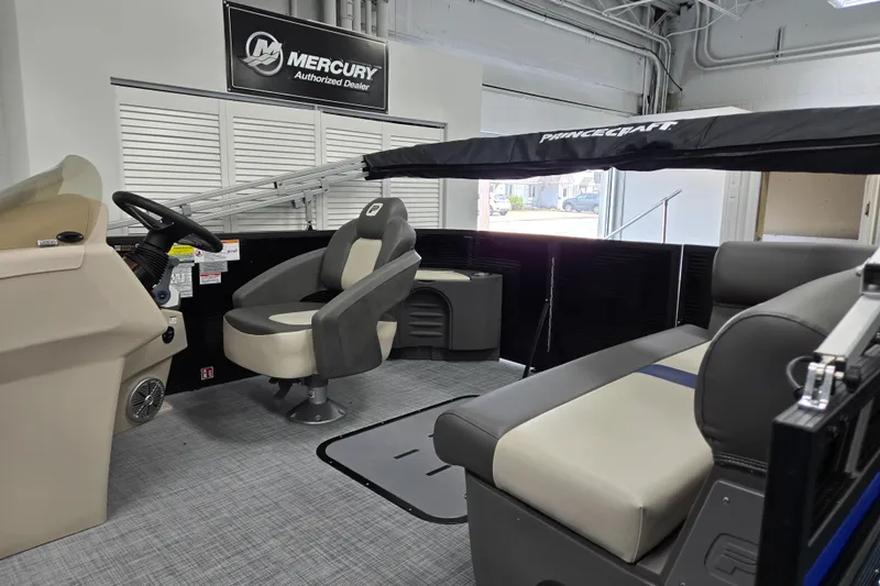 Slide: The Image of 2026 Princecraft Brio 17 Electric boat interior with seating and steering console. - 5