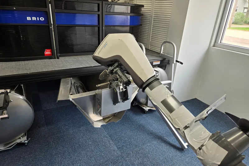 Slide: The Image of 2026 Princecraft Brio 17 Electric boat with motor, displayed indoors on blue carpet. - 6