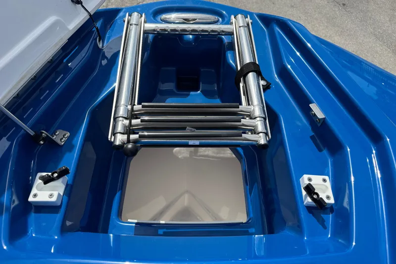 Slide: The Image of 2026 Yamaha Boats 255XD blue deck with stainless steel ladder. - 10