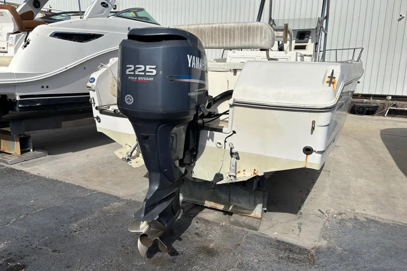 Slide: The Image of 2003 Robalo R230 Center Console boat with Yamaha 225 four-stroke outboard motor. - 11
