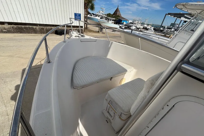 Slide: The Image of 2003 Robalo R230 Center Console boat interior with seating and storage. - 5