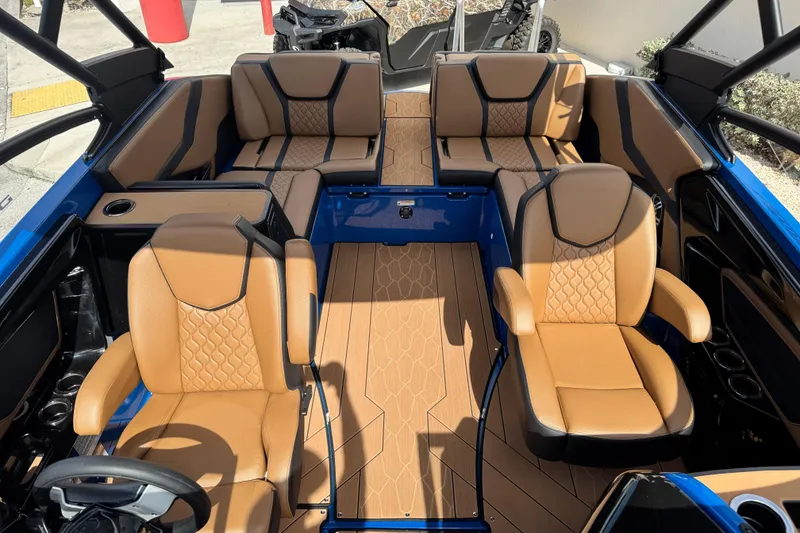 Slide: The Image of 2026 Yamaha Boats 255XD interior with luxurious tan seating and sleek design. - 12