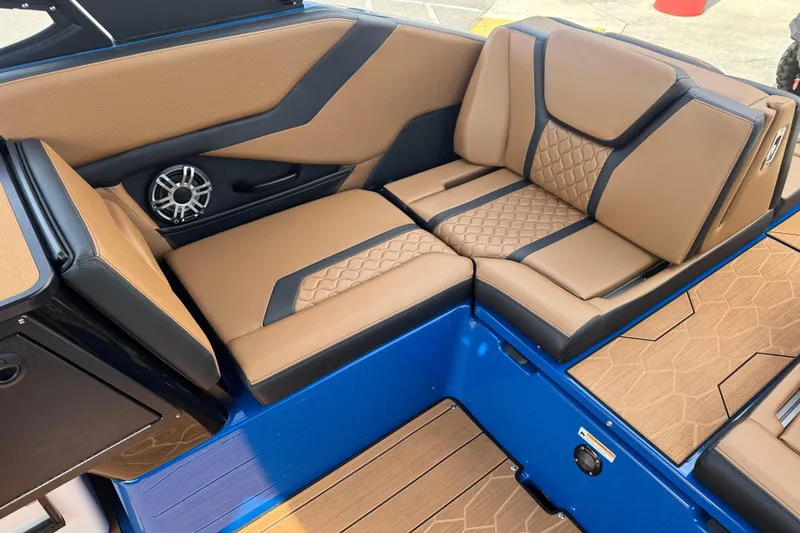 Slide: The Image of Luxurious interior seating of 2026 Yamaha Boats 255XD with tan and black upholstery. - 16