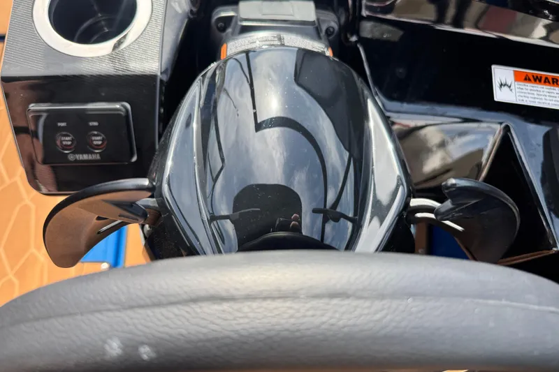 Slide: The Image of Close-up of 2026 Yamaha Boats 255XD steering wheel and controls. - 26