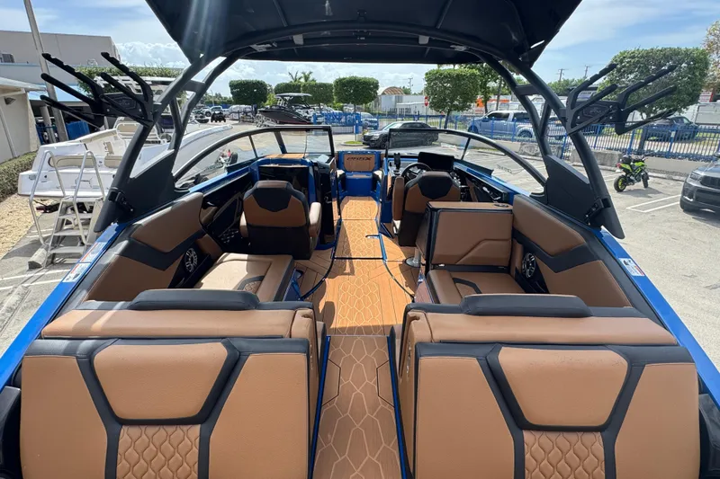 Slide: The Image of 2026 Yamaha Boats 255XD interior with tan seating and modern design. - 5