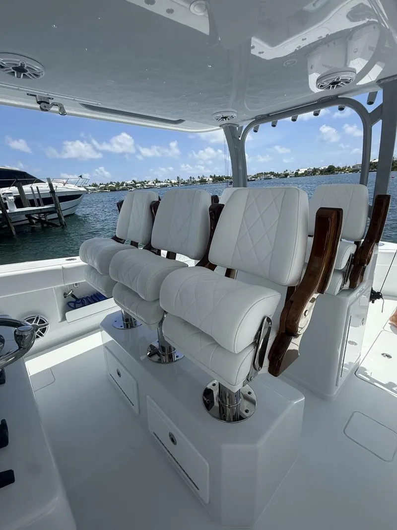 Slide: The Image of Luxurious seating on a 2026 Freeman 38 boat, overlooking a serene waterfront. - 11