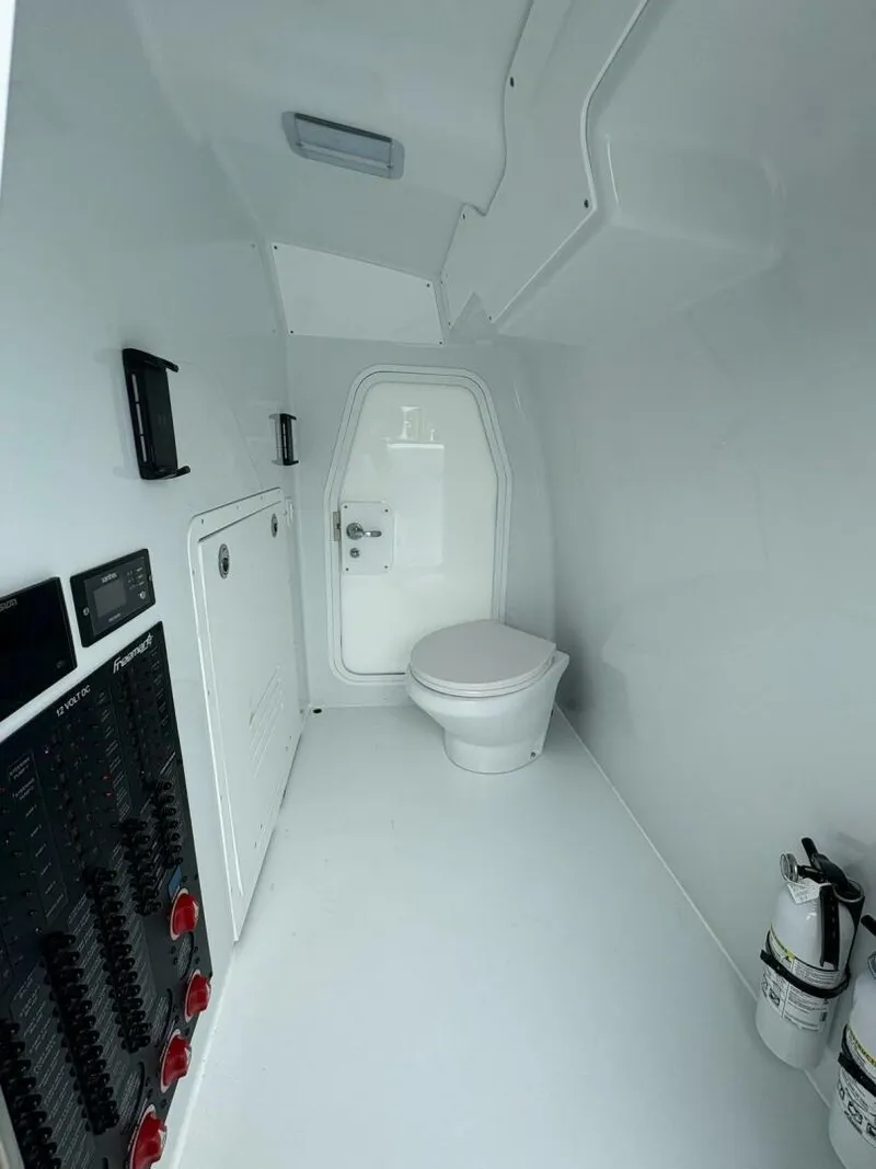 Slide: The Image of Modern boat interior with toilet, control panels, and fire extinguishers in Freeman 38, 2026 model. - 23