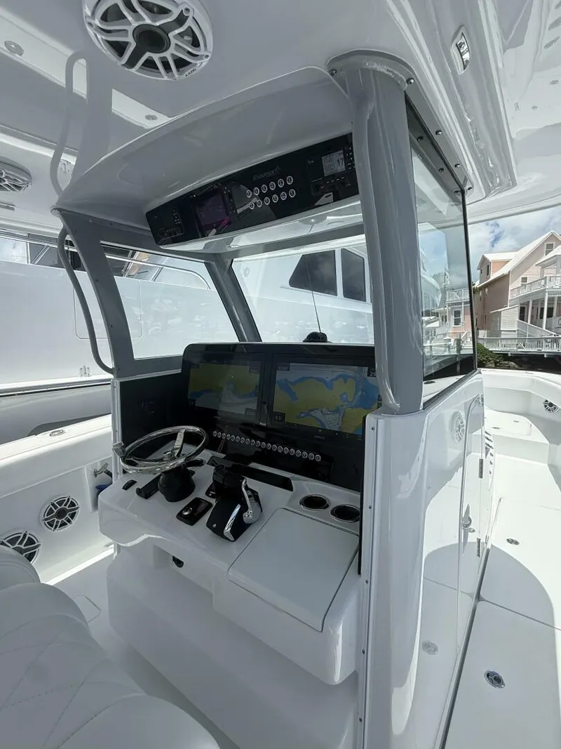 Slide: The Image of Modern Freeman 38 boat cockpit with advanced navigation systems, 2026 model. - 9